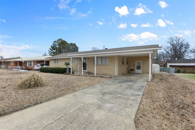 ranch-style home with a carport