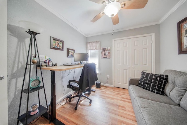 office space with wood finished floors, ornamental molding, ceiling fan, and baseboards