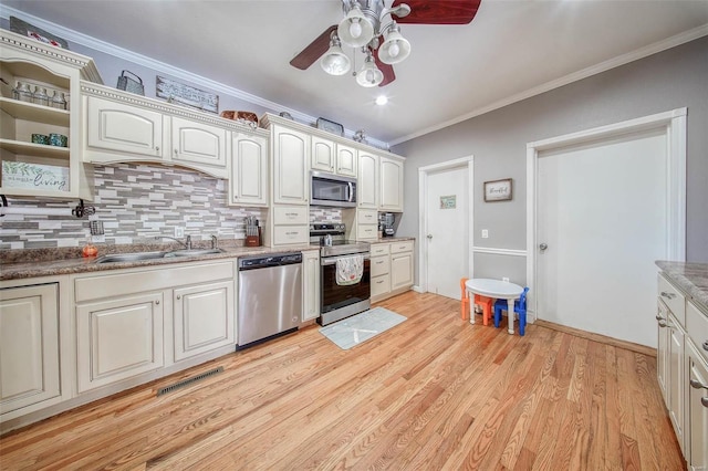 kitchen featuring appliances with stainless steel finishes, a ceiling fan, tasteful backsplash, crown molding, and open shelves
