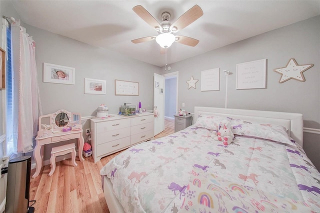 bedroom featuring light wood-style flooring and a ceiling fan