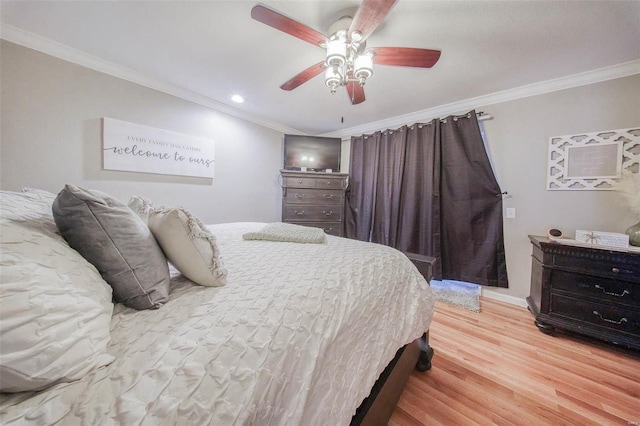 bedroom with ornamental molding, wood finished floors, recessed lighting, ceiling fan, and baseboards