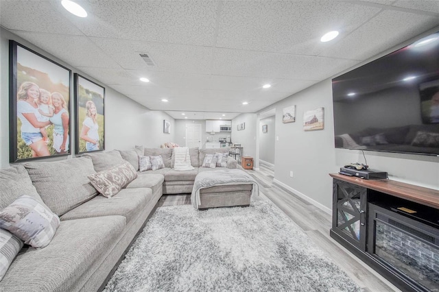 living area with wood finished floors and baseboards