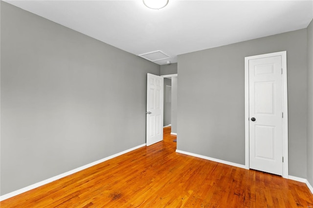 unfurnished bedroom featuring hardwood / wood-style flooring