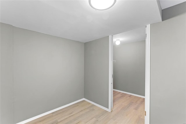 unfurnished room with light hardwood / wood-style floors