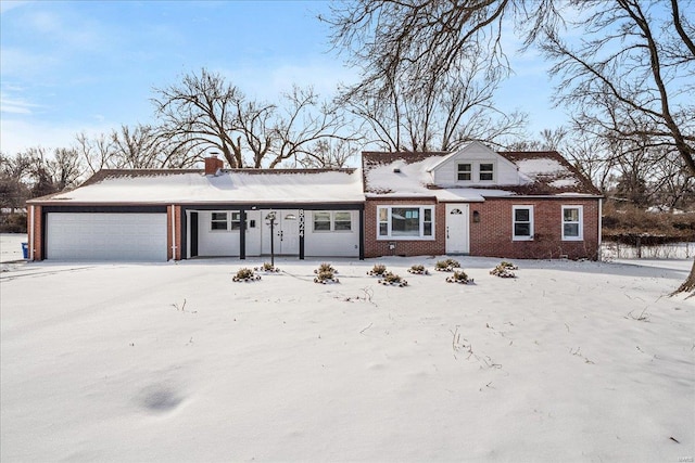 view of front of house with brick siding and a garage