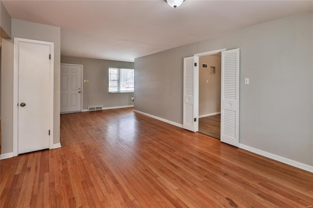 empty room with light wood-type flooring