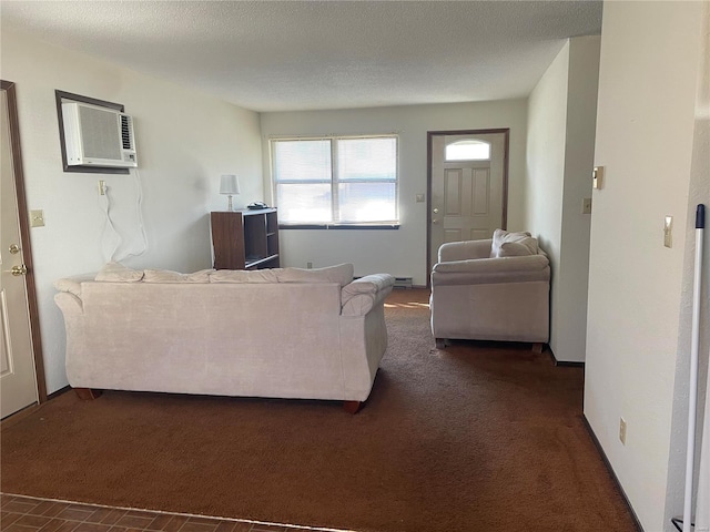 living area with a wall unit AC, dark colored carpet, and a textured ceiling