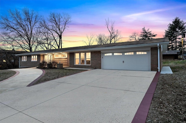 single story home featuring a garage