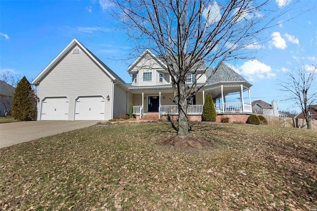 view of front of home with a front yard, covered porch, and driveway