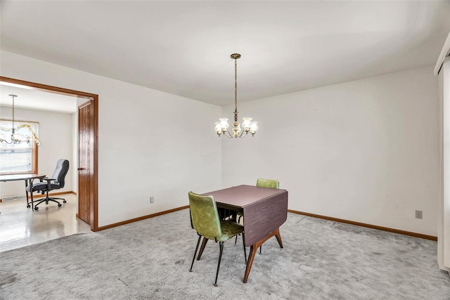 carpeted dining room with baseboards and a notable chandelier