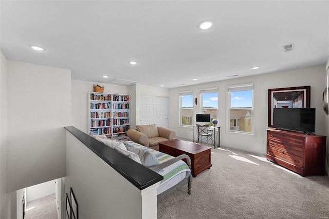 living room with light colored carpet, visible vents, and recessed lighting