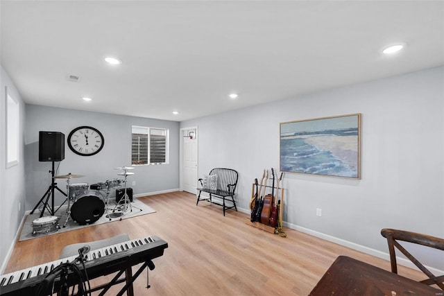 office featuring light wood-style flooring, baseboards, recessed lighting, and a wealth of natural light