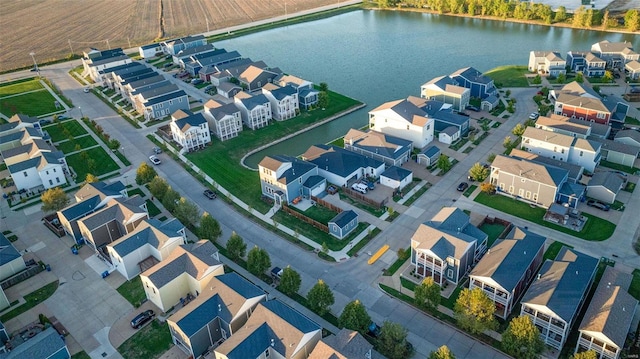 birds eye view of property featuring a residential view and a water view