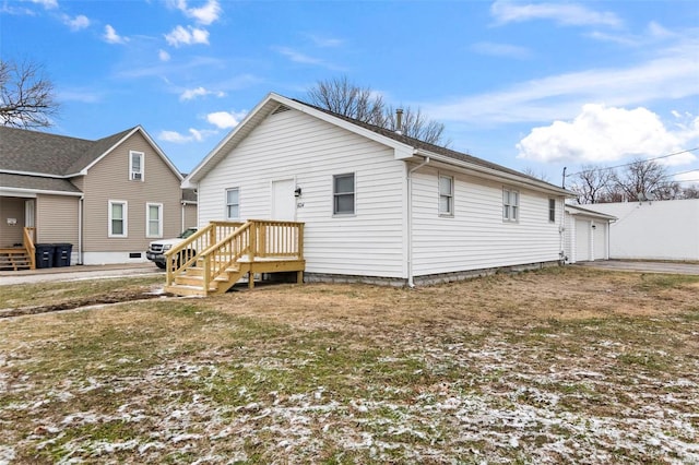 back of property featuring a garage