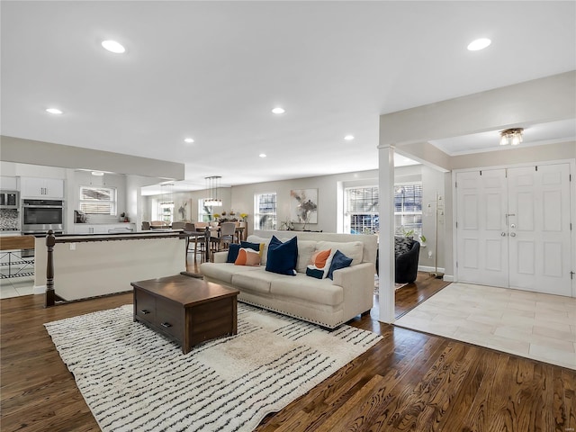 living area with recessed lighting and wood finished floors