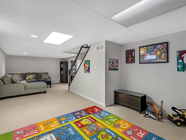 rec room featuring a drop ceiling, visible vents, baseboards, and carpet floors