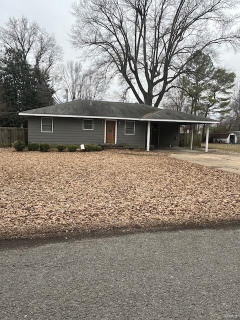 single story home with a carport