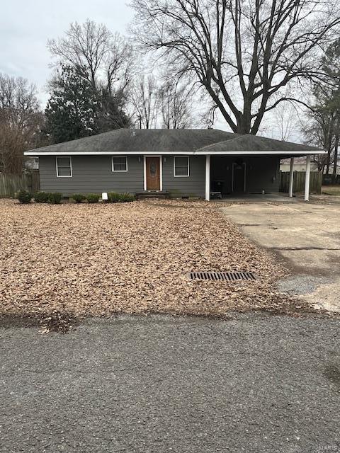 ranch-style home with a carport