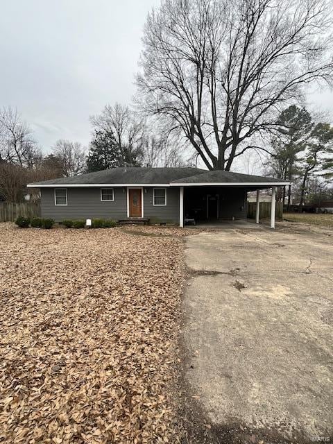 single story home with a carport