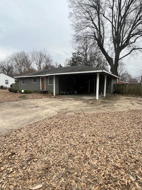 view of front of home featuring a carport