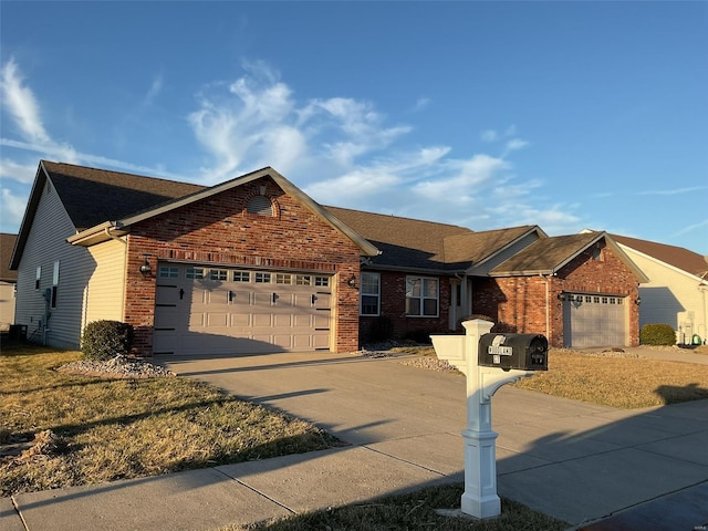 single story home with concrete driveway, brick siding, and an attached garage