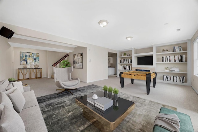 living area with carpet flooring and baseboards