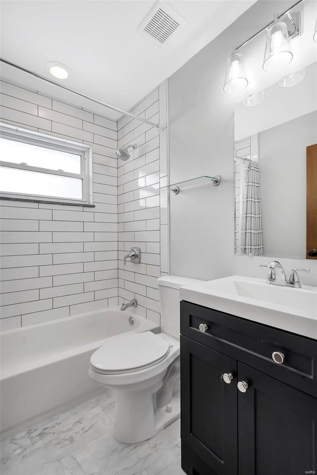 full bath with vanity, marble finish floor, visible vents, toilet, and shower / bath combo with shower curtain