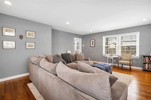 living area with baseboards, dark wood-style floors, and recessed lighting