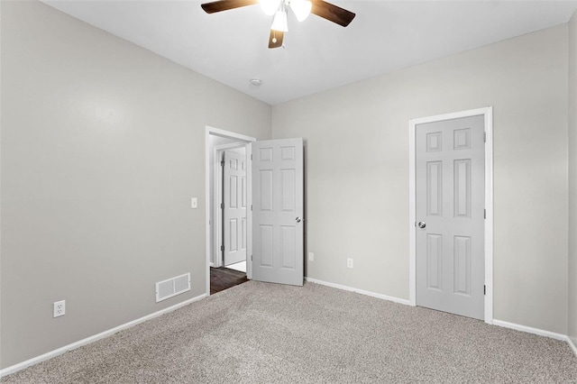 unfurnished bedroom featuring carpet flooring and ceiling fan