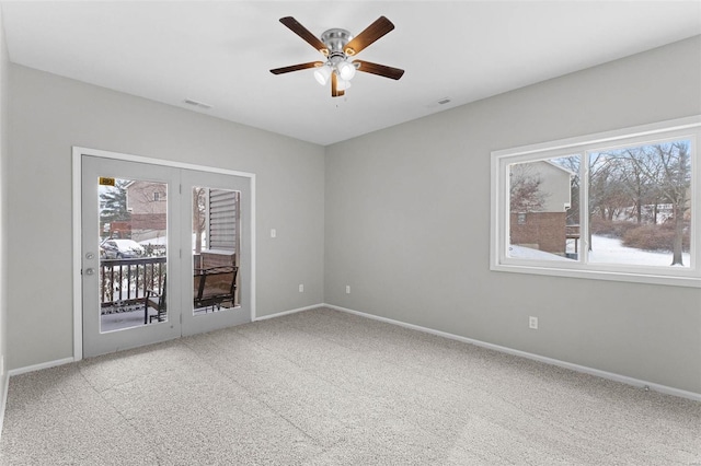 carpeted empty room featuring ceiling fan