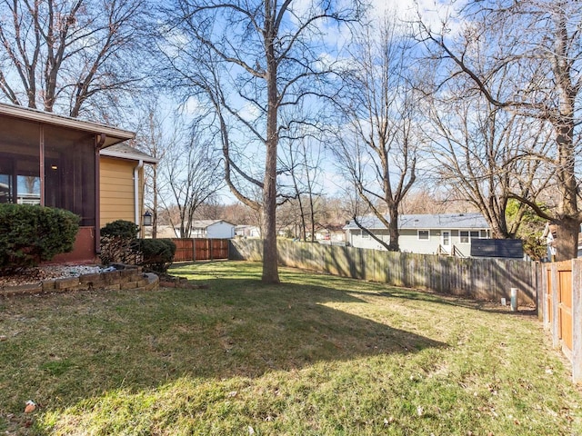 view of yard with a fenced backyard