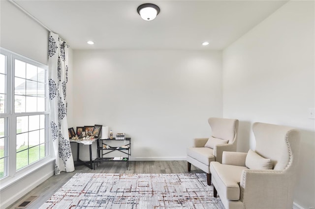 sitting room with hardwood / wood-style floors