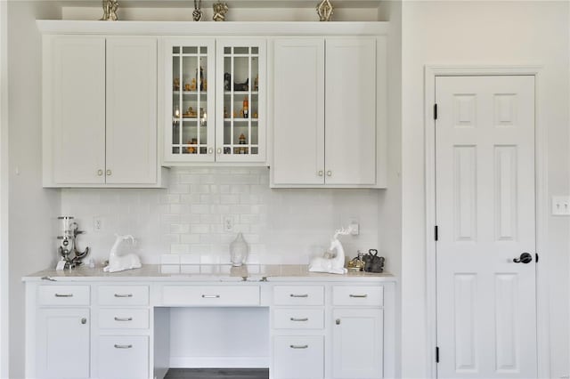 kitchen with white cabinetry and backsplash