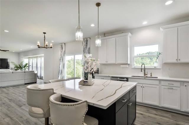 kitchen featuring sink and white cabinetry