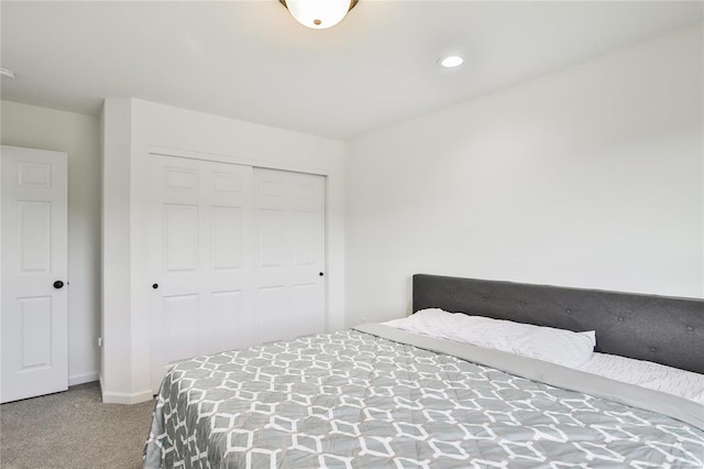 bedroom with carpet flooring and a closet