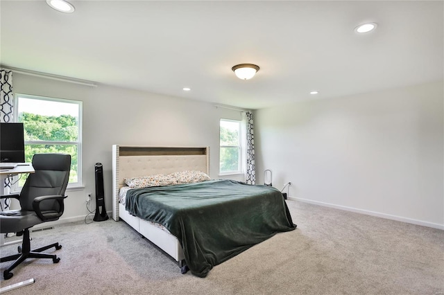 bedroom featuring light colored carpet