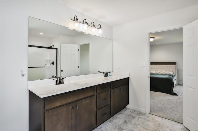 bathroom with vanity and an enclosed shower