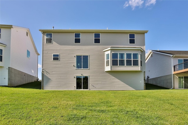 back of house with a yard