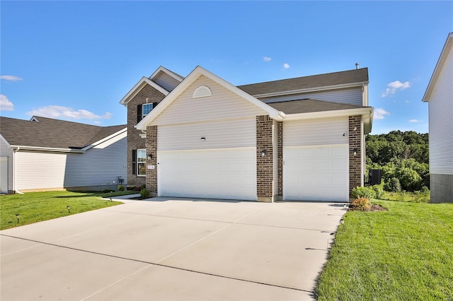 view of front of home with a front yard and a garage