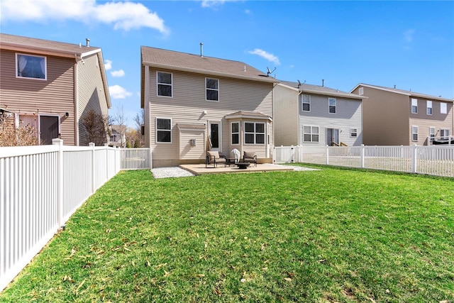 back of house featuring a patio area, a yard, and a fenced backyard