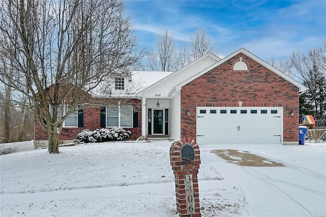 view of front of house with a garage and brick siding