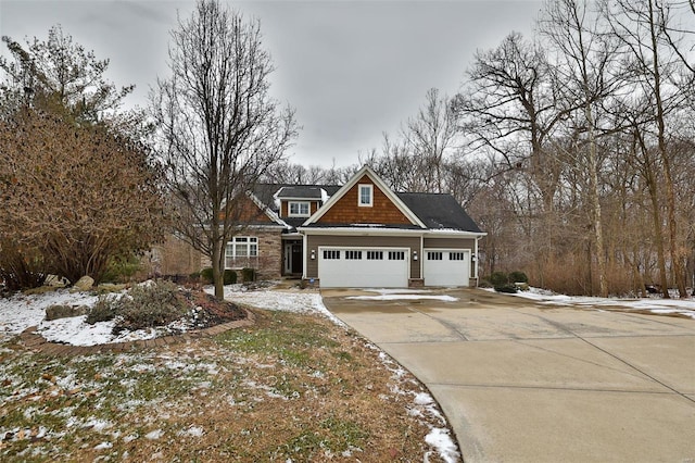 view of front facade with concrete driveway and an attached garage