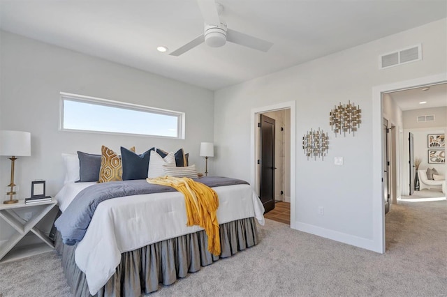 bedroom featuring light carpet, baseboards, and visible vents