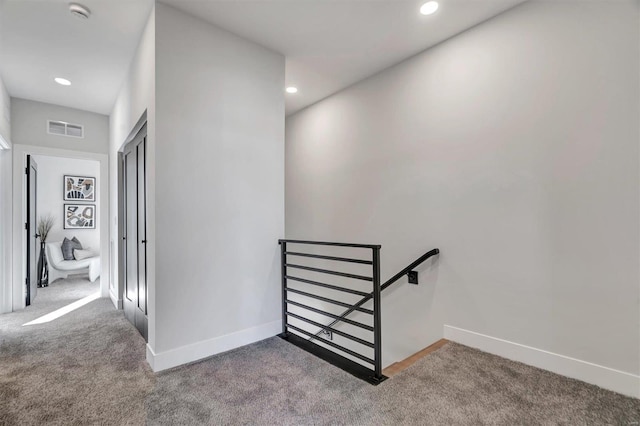 stairs with carpet, visible vents, baseboards, and recessed lighting