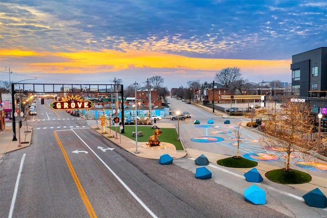 view of street with sidewalks, street lighting, and curbs