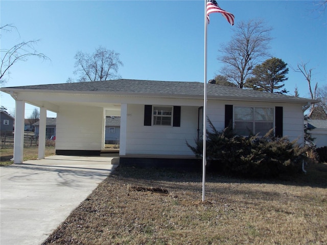 single story home featuring a carport