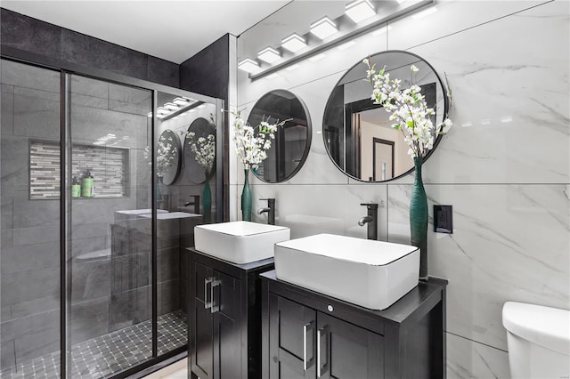 full bathroom featuring a sink, tile walls, and a shower stall