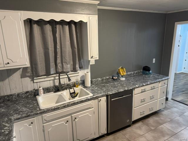 kitchen with crown molding, white cabinetry, dishwasher, and sink