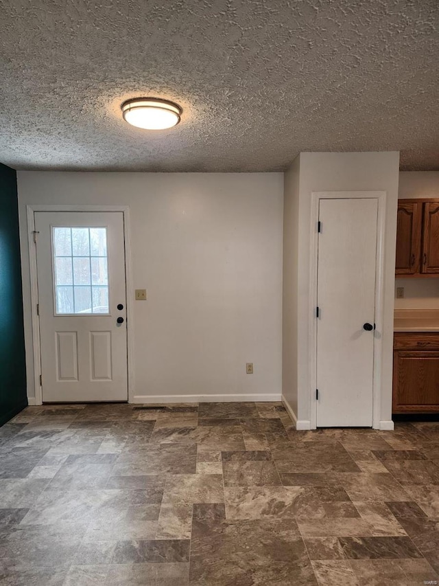 interior space featuring a textured ceiling