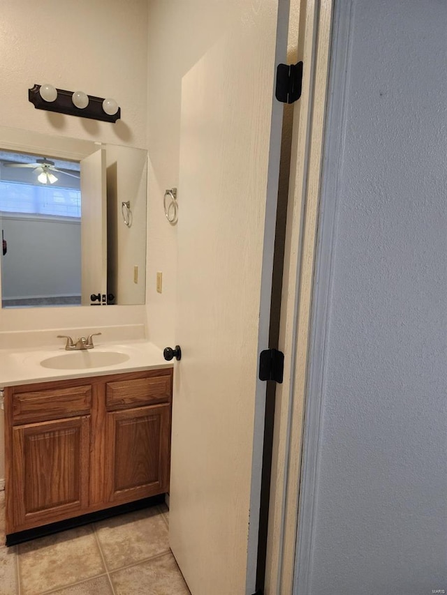 bathroom with tile patterned floors and vanity